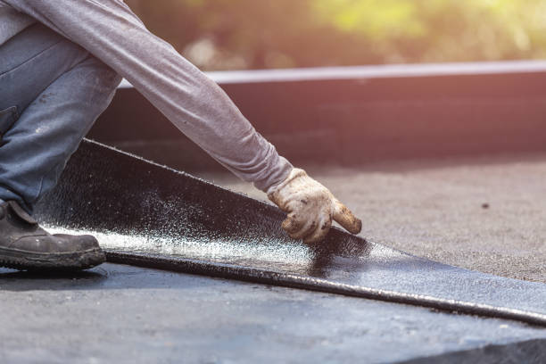Professional Exterior Waterproofing technician working in Utica, NY